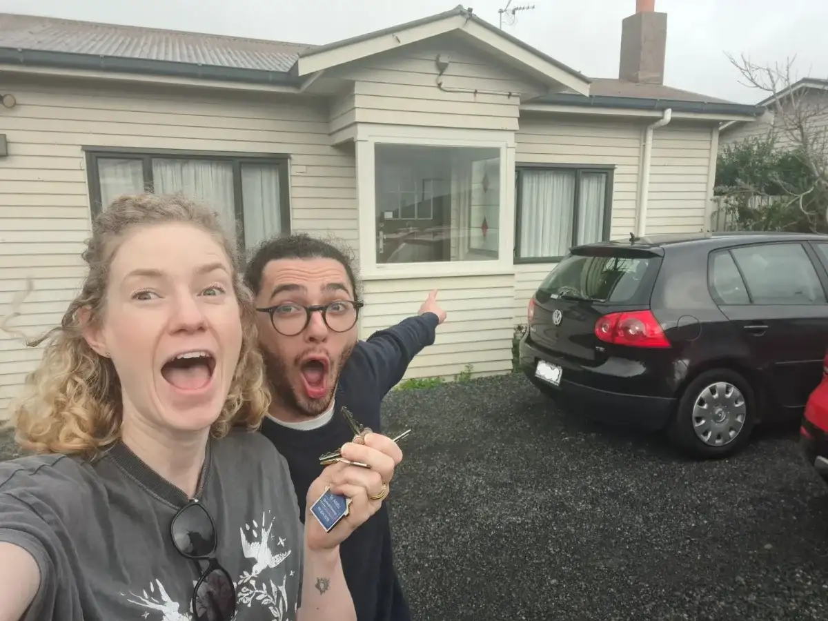 Couple holding the keys to their new home